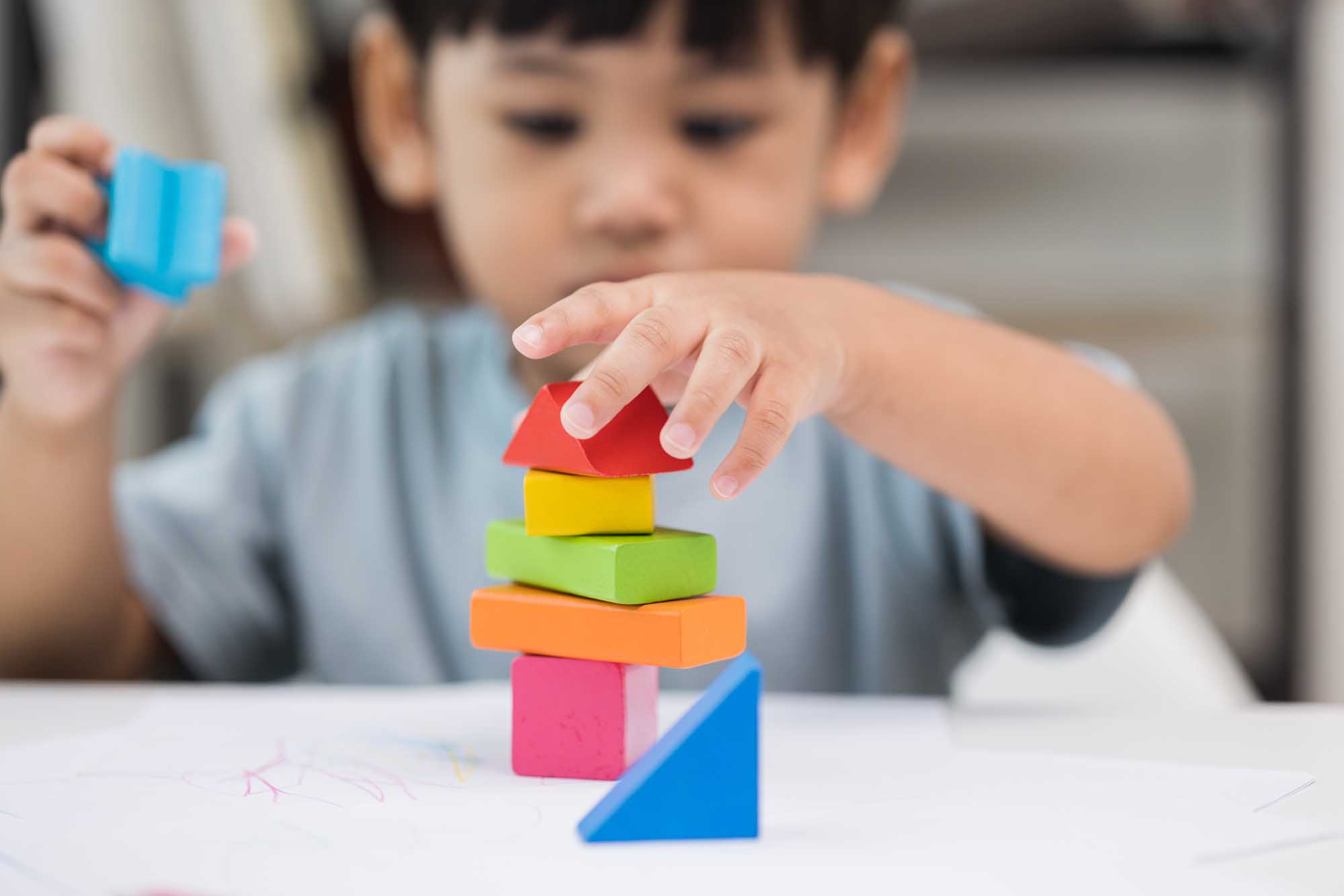 Close up Children hand Practice the skills of playing with woode Mountains ABA ABA Therapy in New Hampshire37