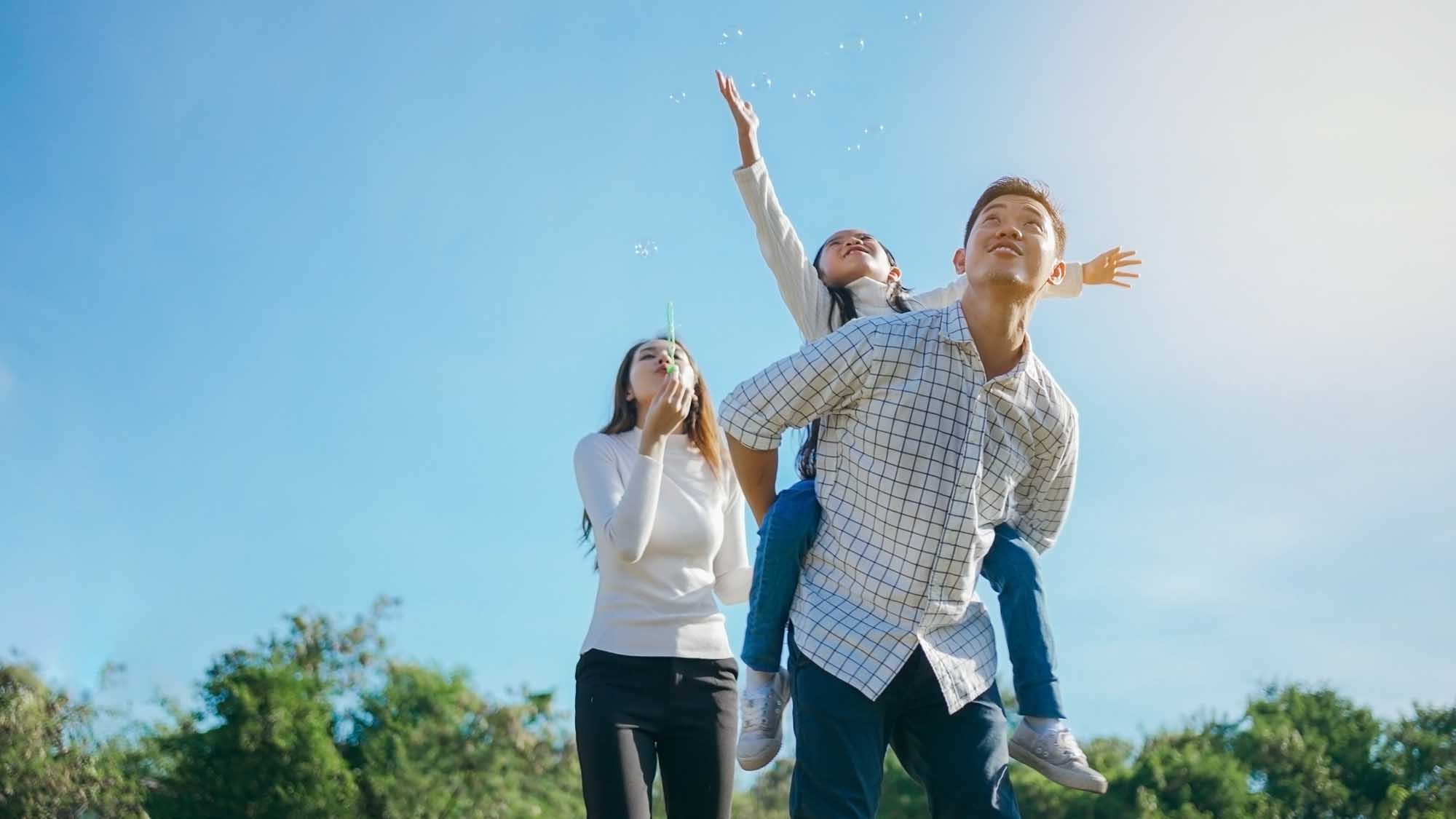 Happy asian family in the garden They are having fun playing and blowing bubbles. and enjoyed ourselves together in the green garden. Family enjoying sunny fall day in nature. Mountains ABA ABA Therapy in New Hampshire38